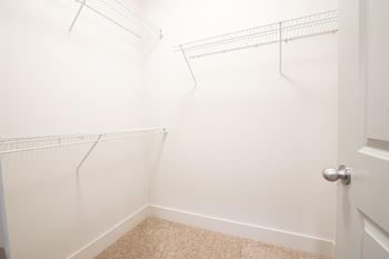White closet with empty shelves